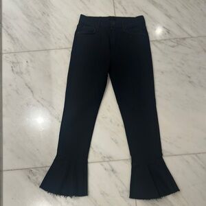 MOTHER Black denim cropped with dramatic ruffle hem.